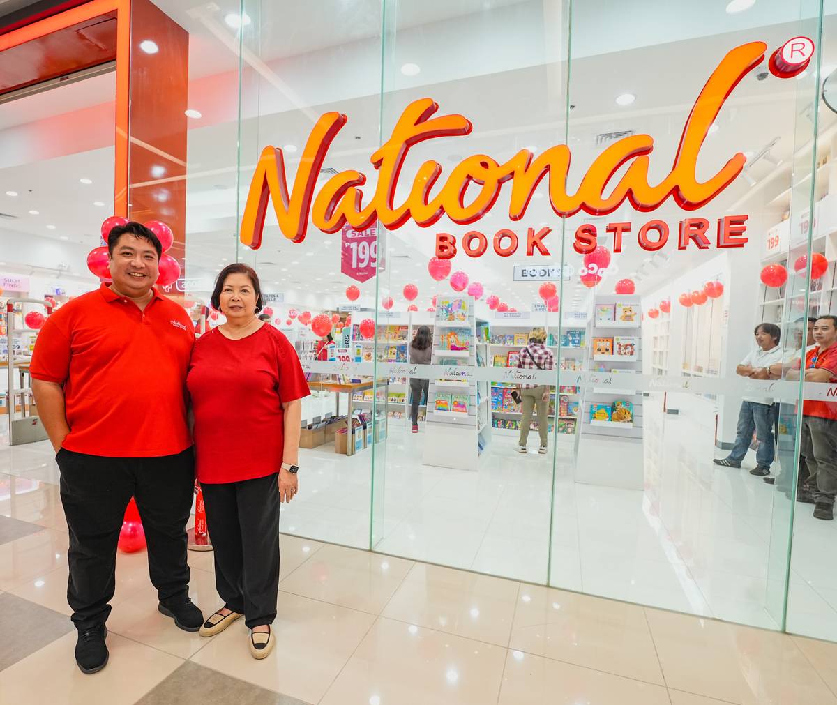 National Bookstore’s Precy Ramos (right) and son Adrian